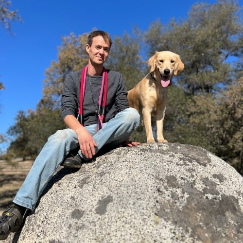 Aaron and dog on top of a big rock